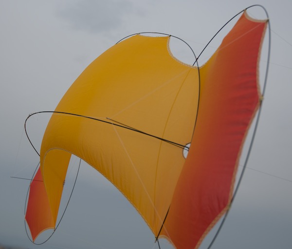 O2 Flame - quadline kite - silk shape in the wind from the rear