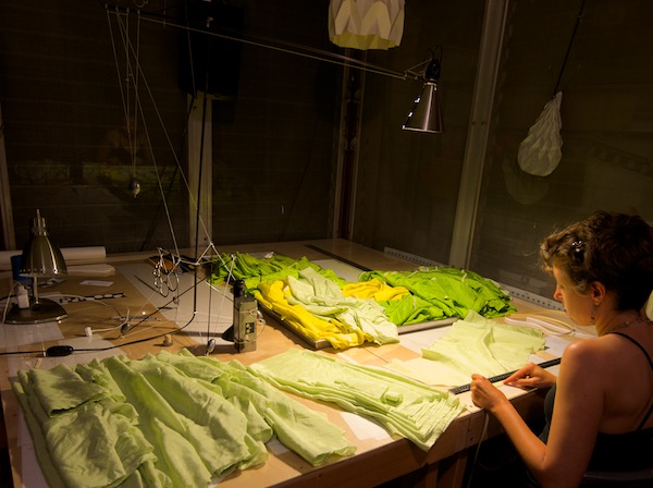 Ruth Whiting building Flowx kites on a work table at windfire designs