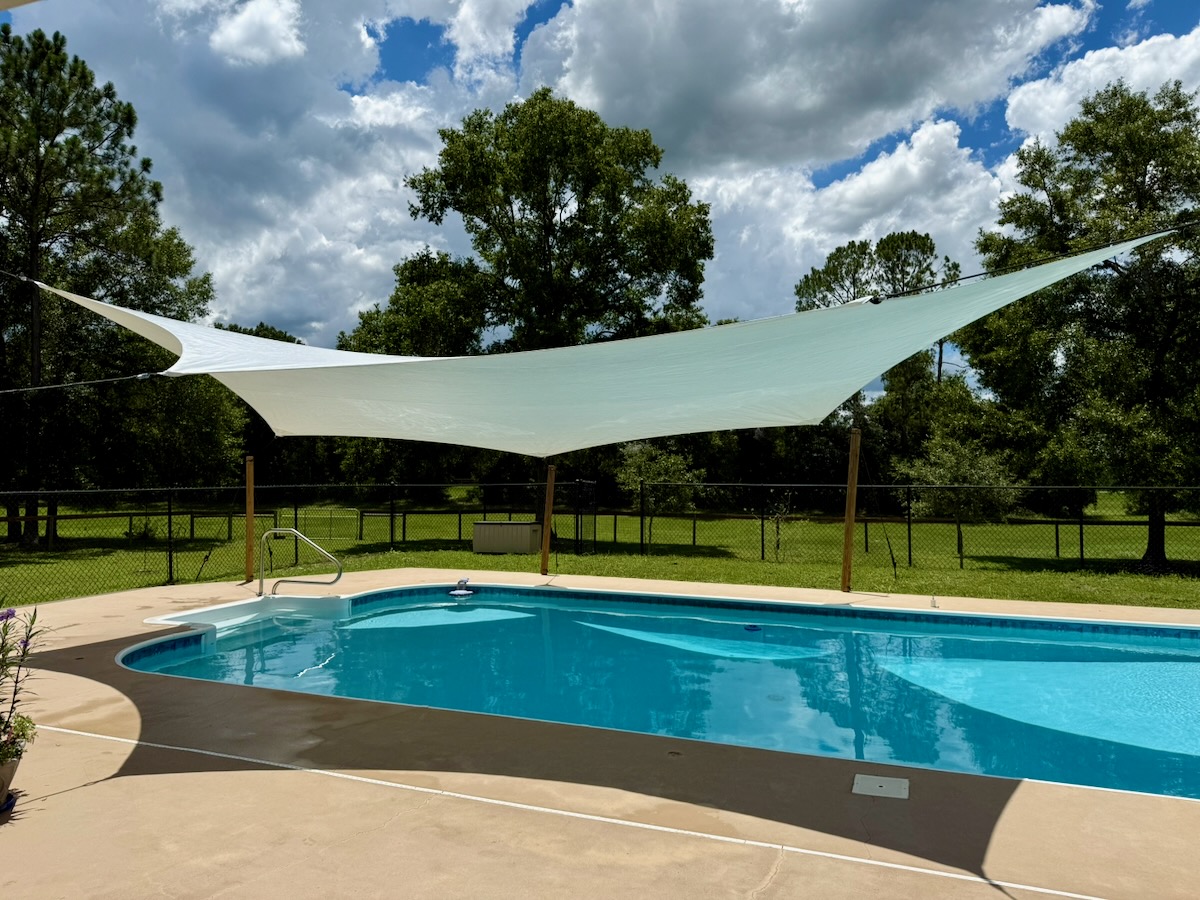 Doing yoga under a windfire designs rainshade structure