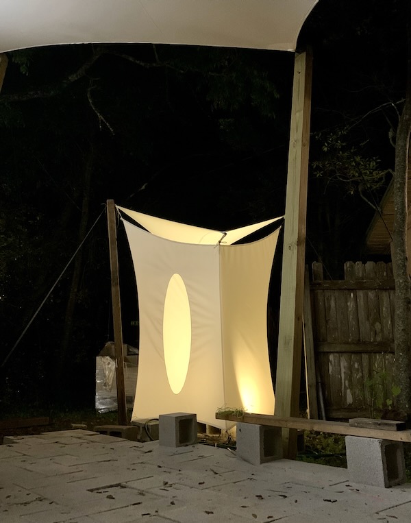 Outdoor shower at night doubling as a lantern