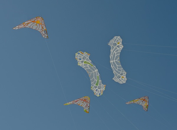 A shot from Cervia, Italy, WindFire Designs Kites, 3 ColorWing Morphos painted by Ruth Whiting, and 2 LaceWing Flames - flown by Anke Sauer, and kite design by Tim Elverston, photo also by Tim