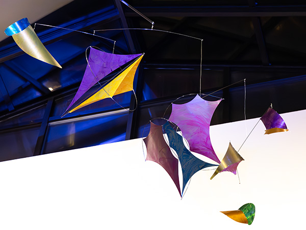 Minerals series kinetic mobiles photographed as a group at night