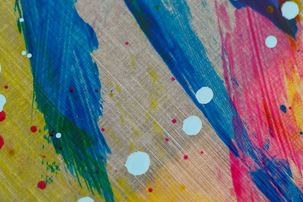 Ruth Whiting reviewing a paint color sample for kinetic art outside
