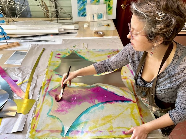 Ruth Whiting painting kinetic mobile stainless steel kite
