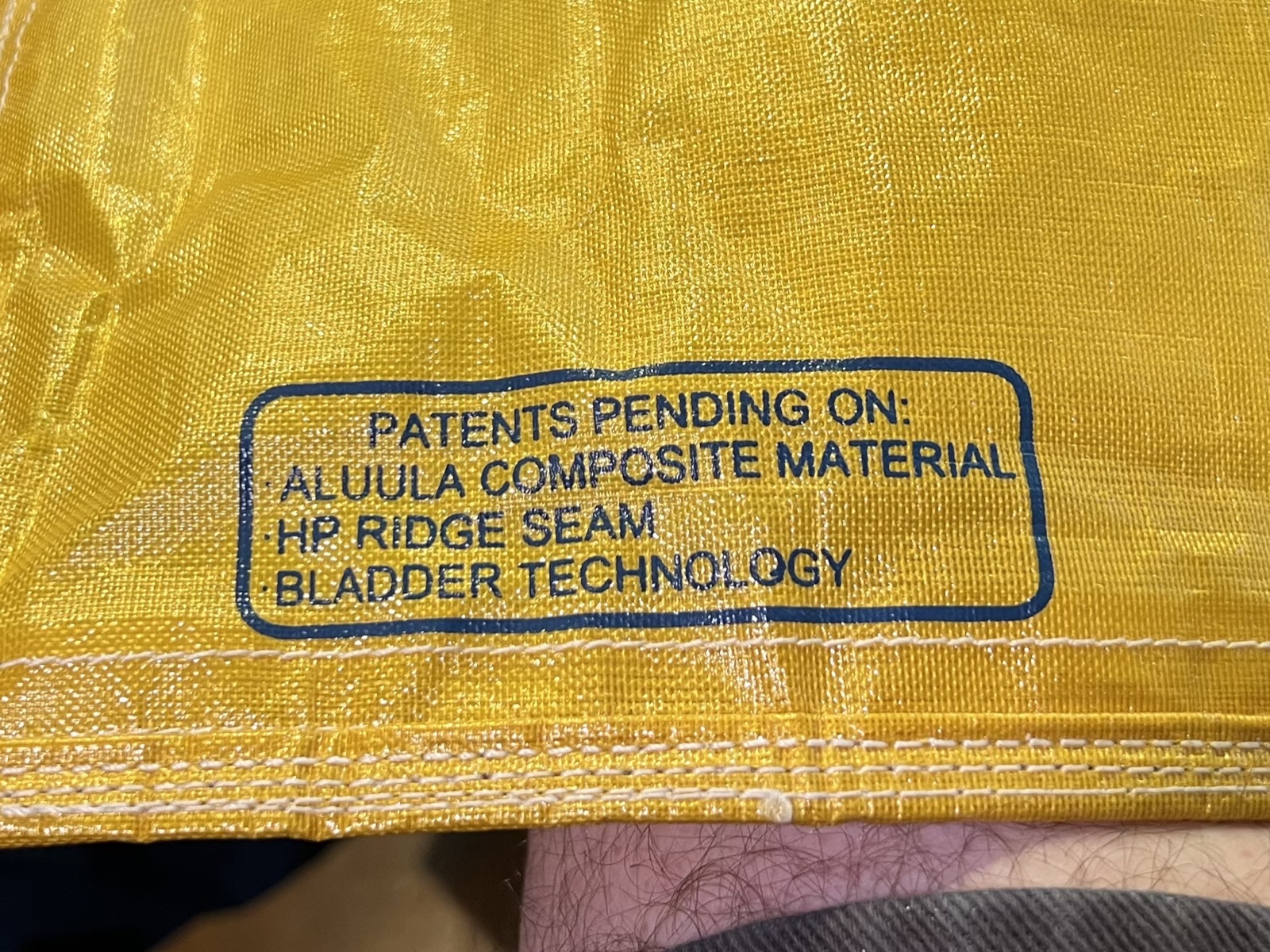 Aluula kite leading edge seam construction showing the doubled adhesive and folded layers