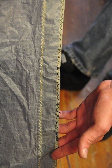 Close-up of a bad kite patch with sewing running off the edge of the fabric