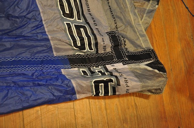 Example of a poorly executed prior kite repair with skipped stitches and trapped wrinkles
