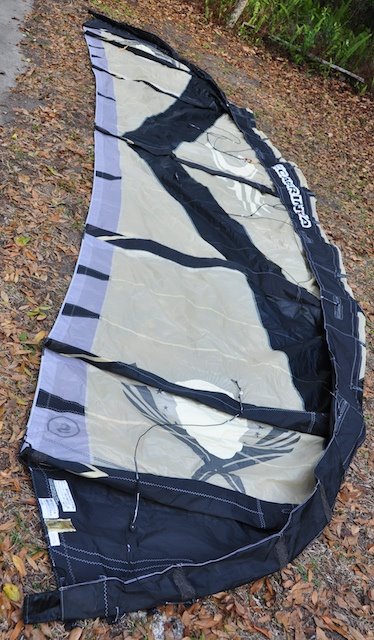 A 2009 Cabrinha Crossbow kite laid out in the WindFire Designs shop for repair