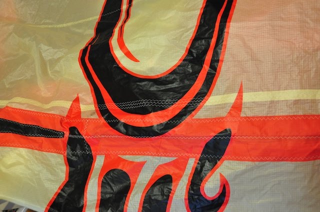 Bright yellow Cabrinha kite cloth used for a graphics-matched repair