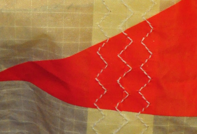 Finished Cabrinha kite repair showing precise alignment of the stitching lines