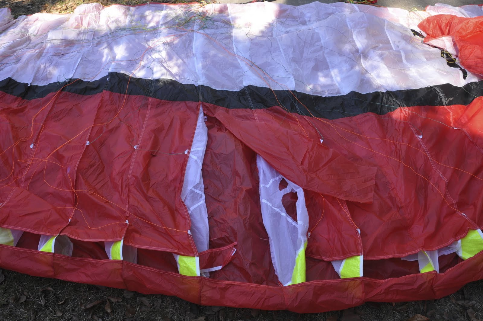 Pro Designs paraglider wing with damaged cells before repair