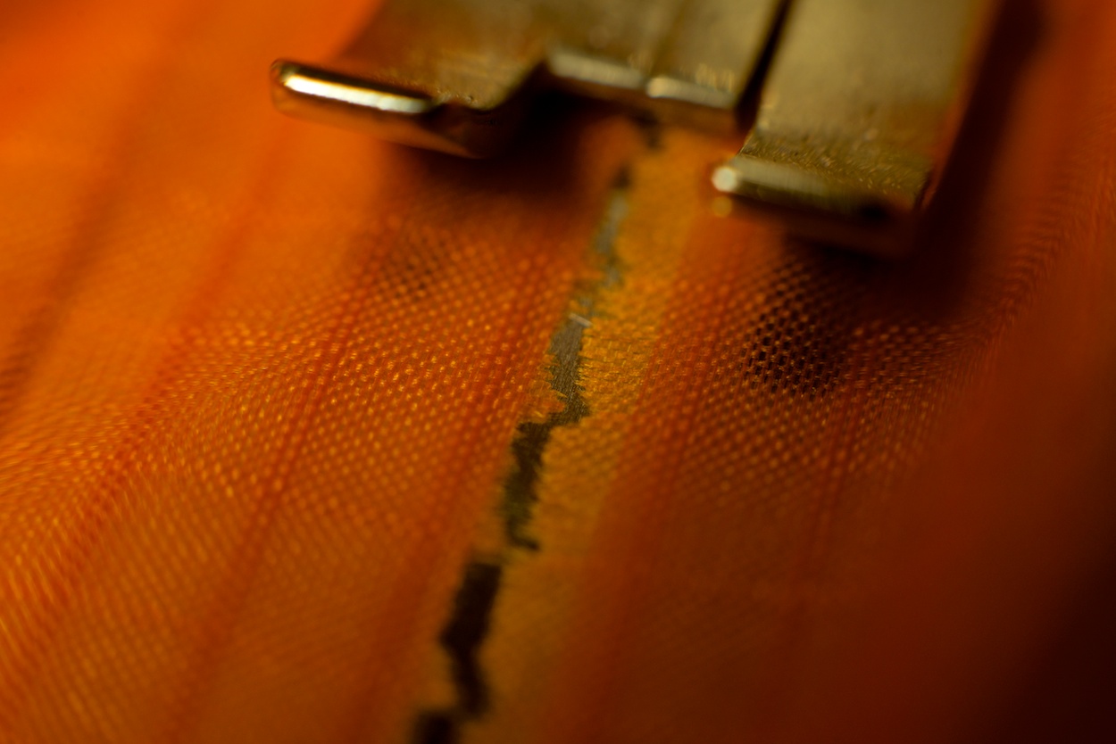 Dudek Nemo paraglider repair by WindFire Designs — close-up of fiber alignment during patch repair
