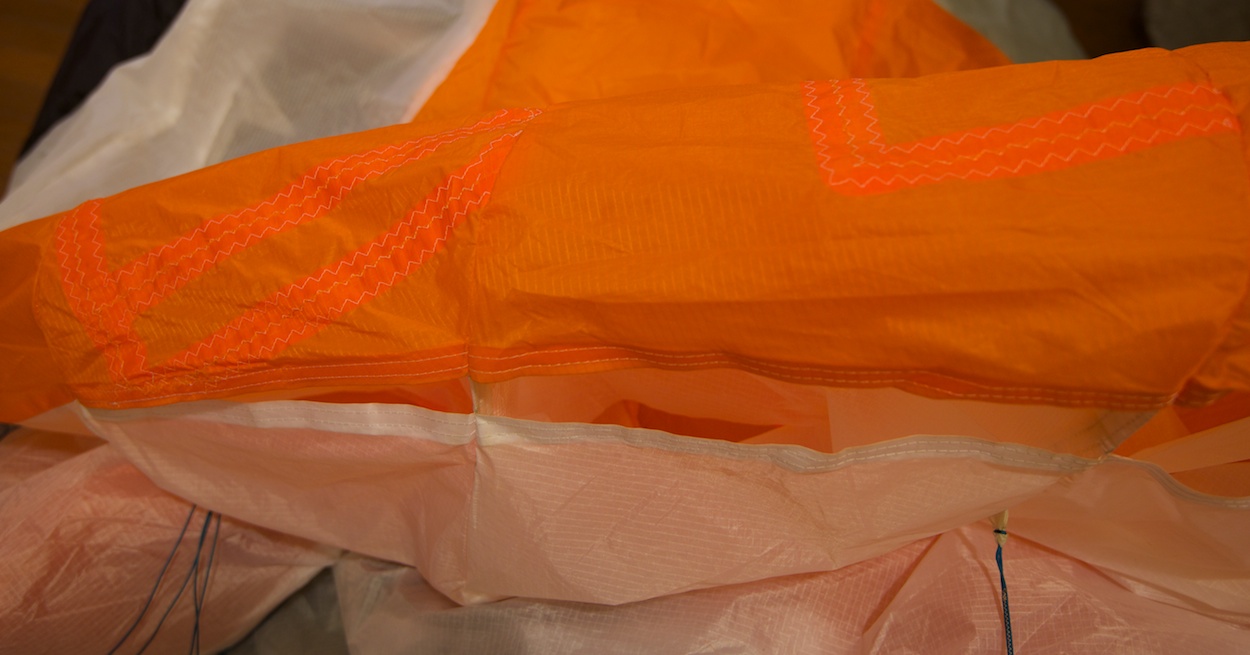 Dudek Nemo paraglider repair by WindFire Designs — close-up of fiber alignment during patch repair