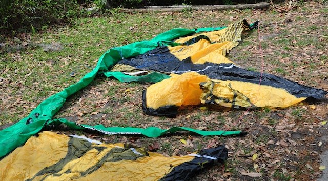 Heavily damaged Naish kite with struts separated from the canopy