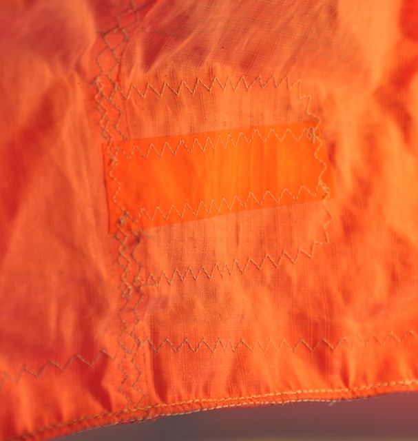 Sewn leading edge repair replacing a failed adhesive-only patch