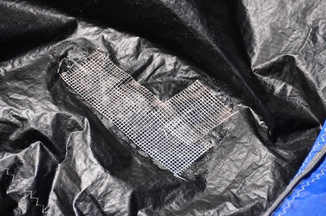 Kitefix patch showing the stiff, hardened texture of the cured adhesive
