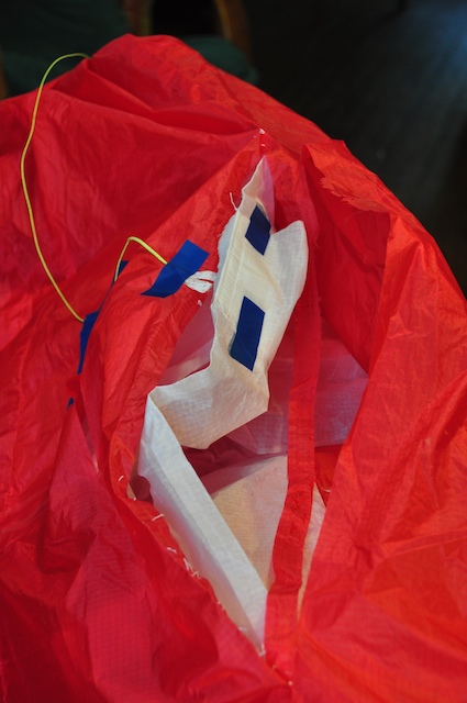 Disassembled bridle attachment point on the paraglider during repair