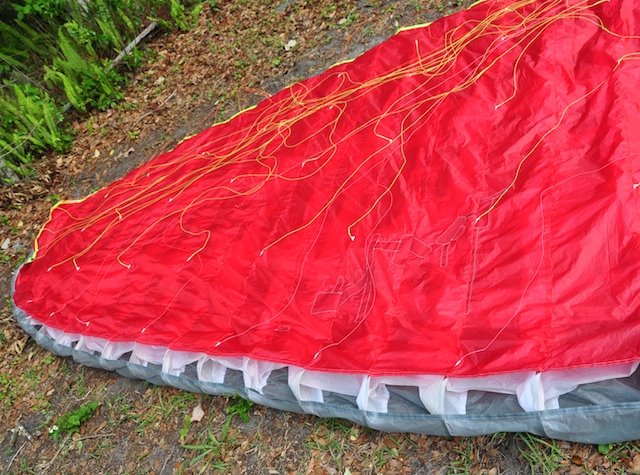Damage spread across several cells on the paraglider's lower skin
