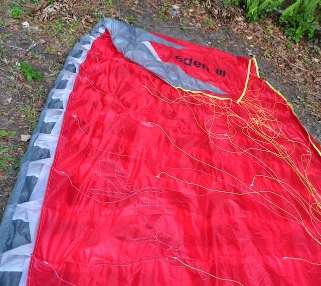 Small distributed lacerations across the paraglider cells