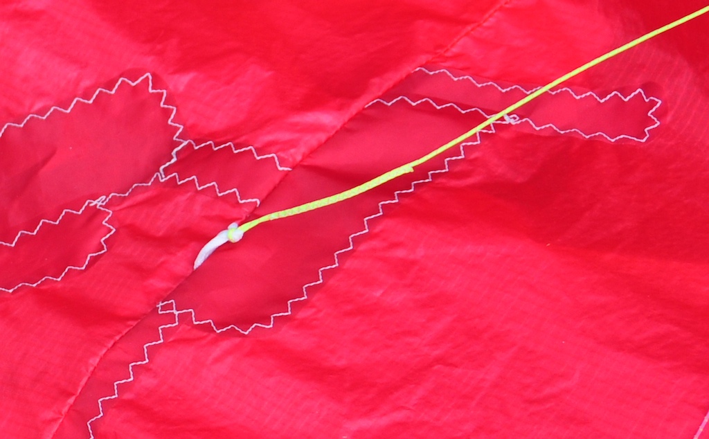 Repaired paraglider cells with dribs and bridle point reattached