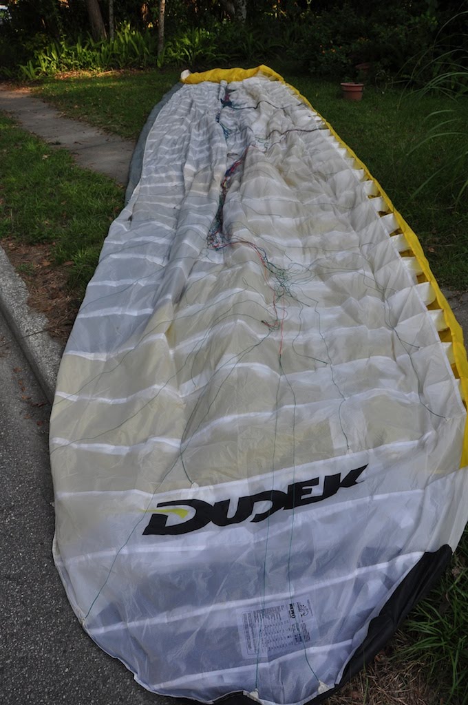 Dudek 27 meter powered paraglider wing laid out for repair