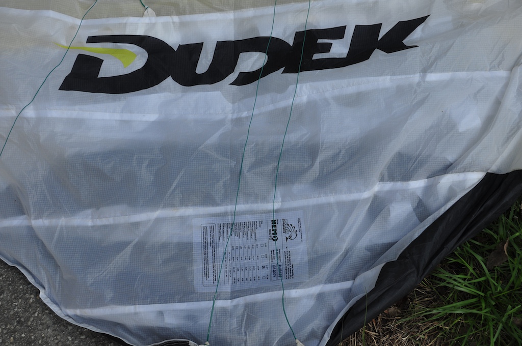 Damaged cell on the powered paraglider wing caused by the motor and prop