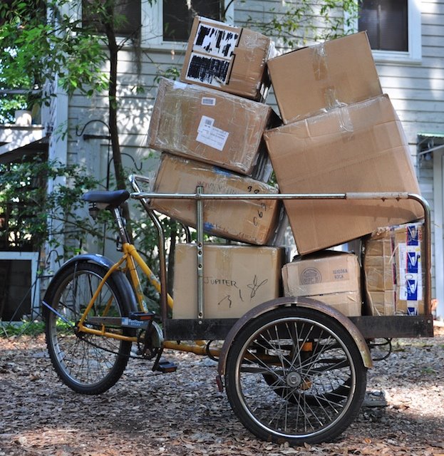 Worksman Frontloader tricycle loaded with kite repair boxes, used to move kites for shipping